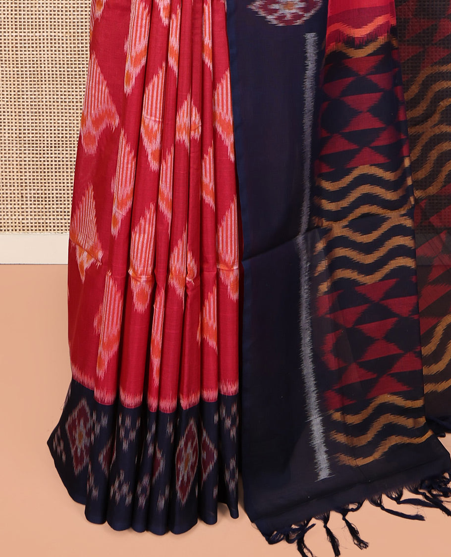 Red Ikkat Cotton Saree, Decorated with Ikkat-style Buttas All Over Its Body, Complemented by a Contrast Ikkat-Textured Border, Pallu of Geometric Patterns, and Paired with a Contrast Blouse