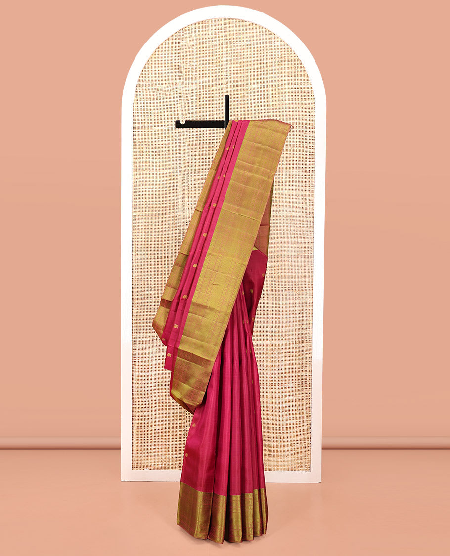 Red Kanchipuram Designer Silk Saree, Subtly Sparkled With Buttas All Over Its Body, Complemented by Contrast Border of Rekku, Rudraksham, Then Kuli Kann, Laddu Kamalam, and Mayil Kann Designs, Jaal Pallu and Paired with a Contrast Blouse