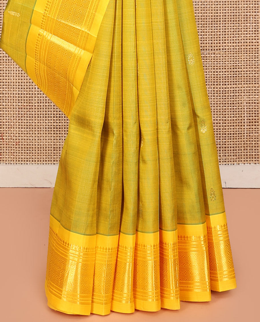 Green Kanchipuram Silk Saree, Woven with Zari Buttas, a Contrast One-Sided Border of Panner Sombu, Banaras, Muthu, and Jaal Design, Zari-Woven Pallu, and No Blouse