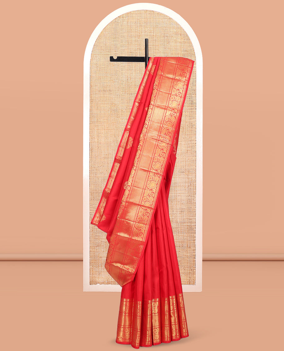 Red Kanchipuram Silk Saree, Spotlighted with Zari Buttas, Highlighted by Zari Border of Rekku, Rudraksham, Paisley Vine and Jaal Designs, Jaal Pallu, and a Matching Blouse