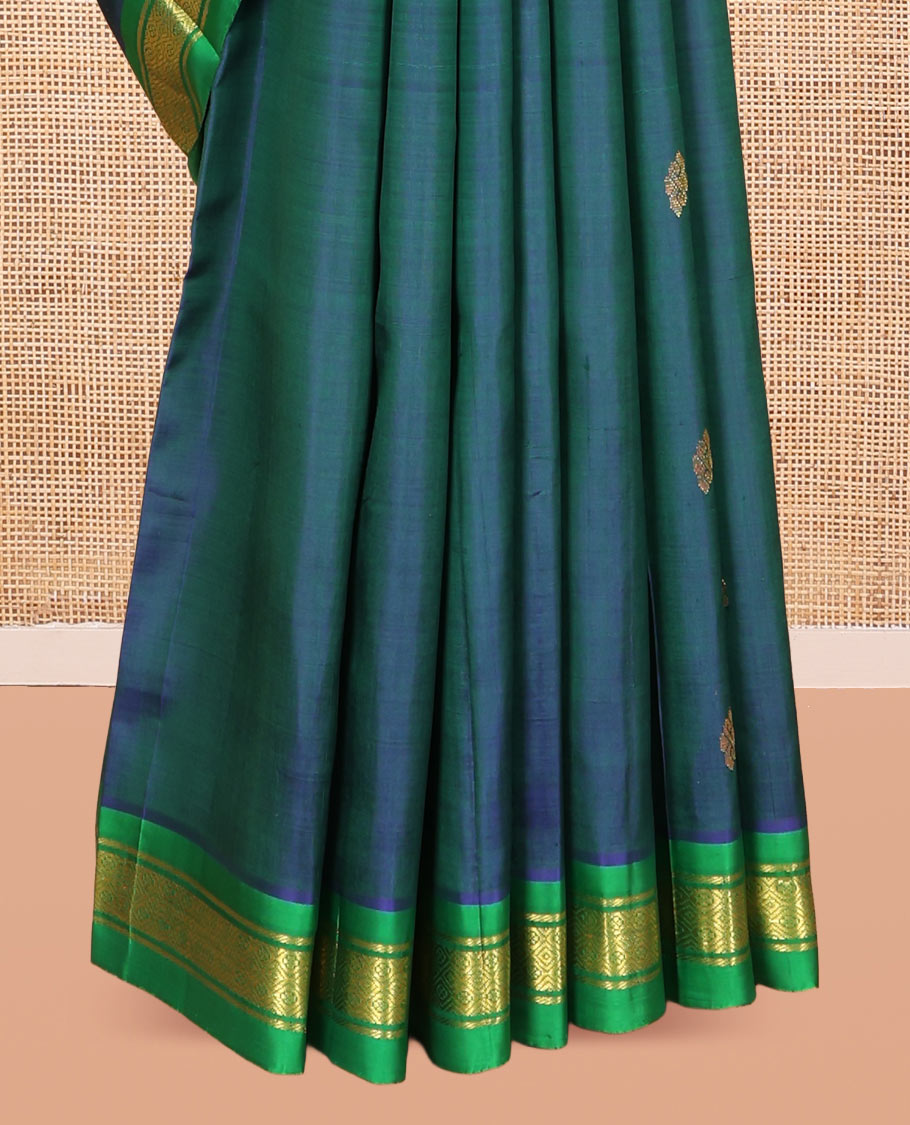 Blue Kanchipuram Silk Saree Featuring Zari Buttas, Complemented by a Contrast One-Sided Border of Banaras, and Jaal Design, Zari Design Pallu, and a No Blouse