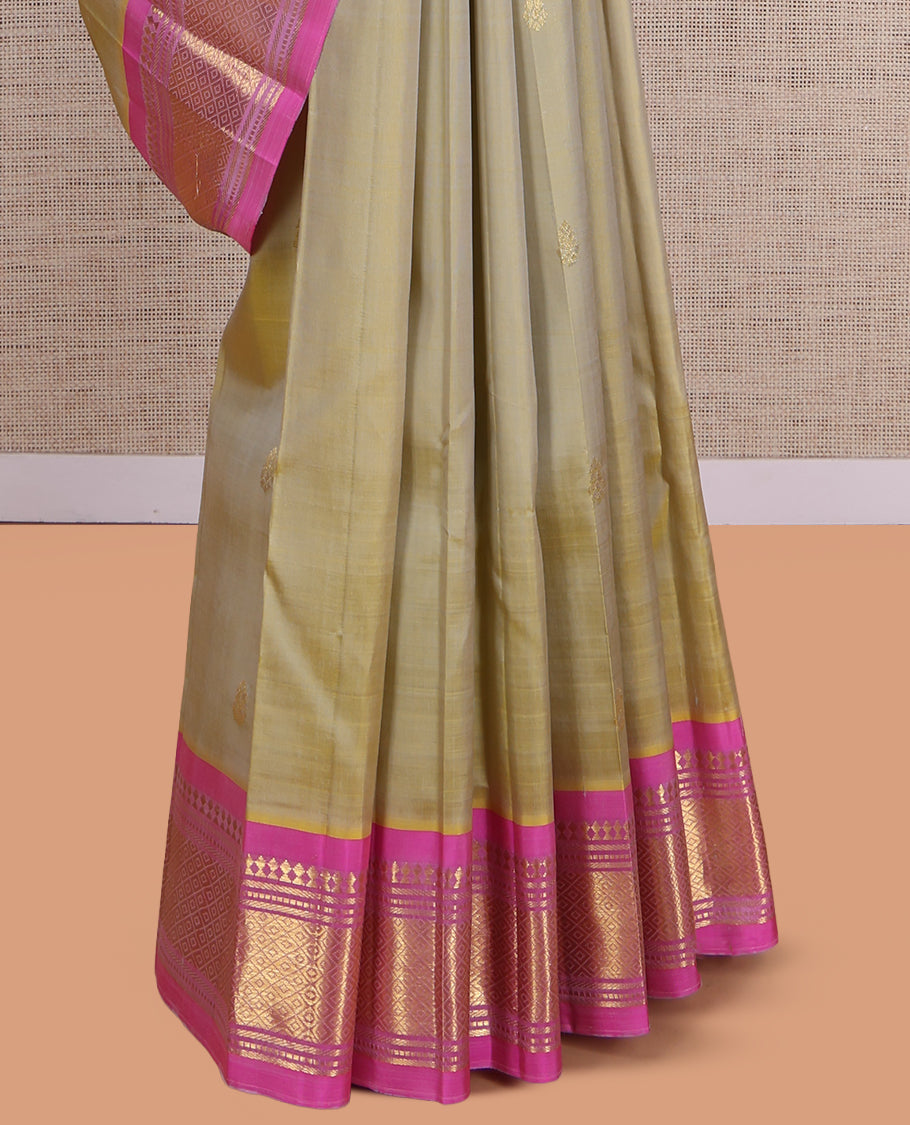 Green Kanchipuram Silk Saree, Embellished with Zari Buttas, a Contrast One-Sided Border of Paneer Sombu, Banaras, Muthu, and Mayil Kann Design, Zari Design Pallu, and No Blouse