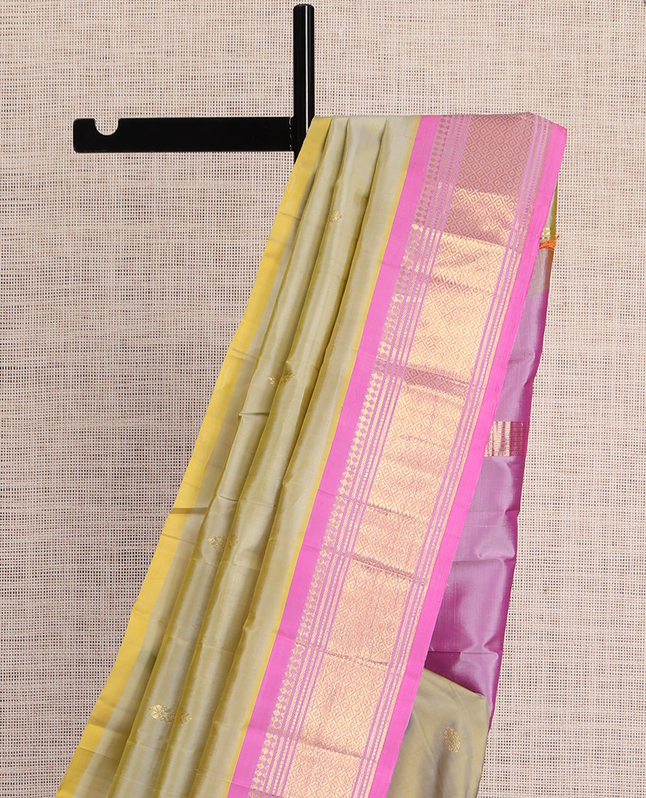 Green Kanchipuram Silk Saree, Embellished with Zari Buttas, a Contrast One-Sided Border of Paneer Sombu, Banaras, Muthu, and Mayil Kann Design, Zari Design Pallu, and No Blouse