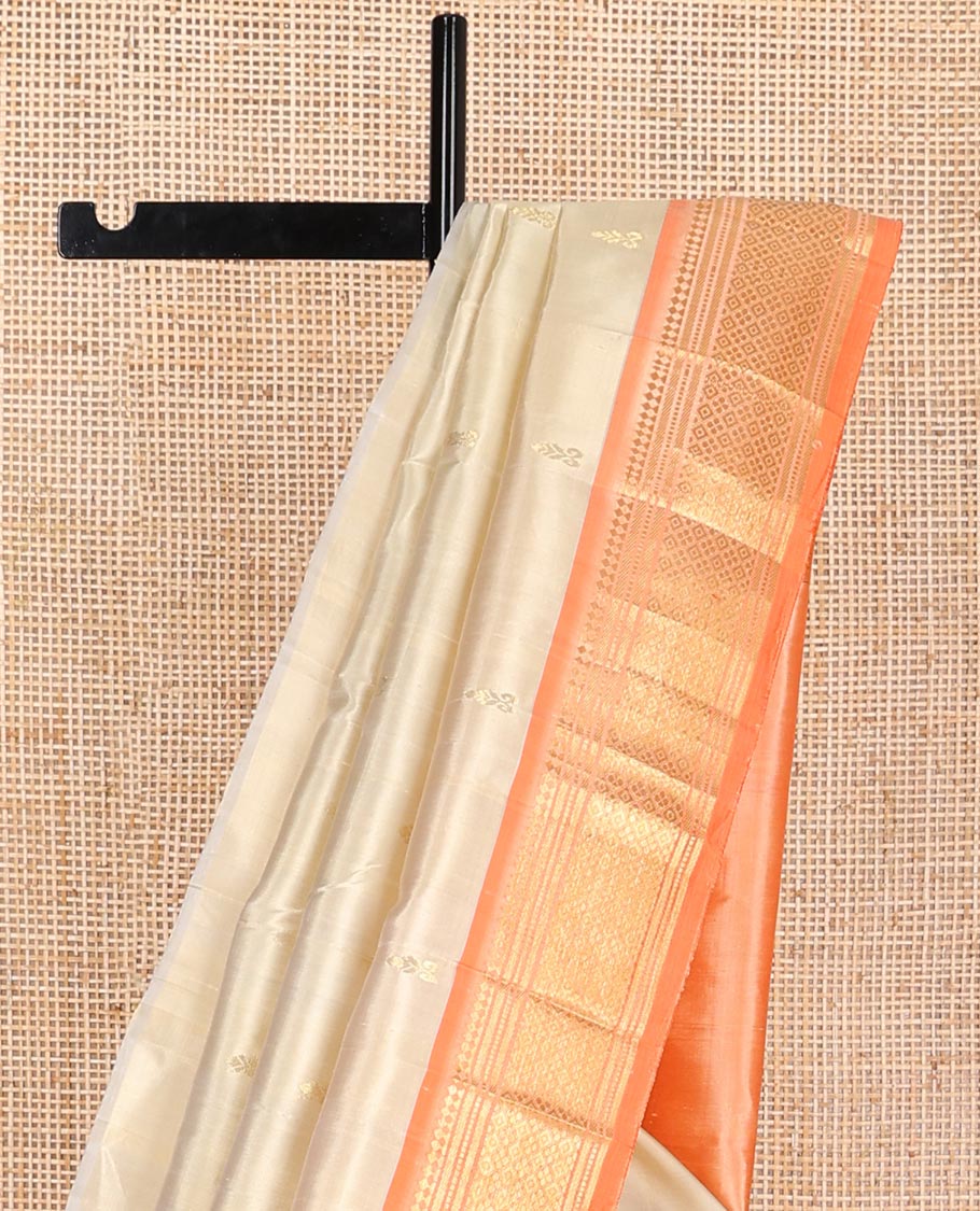 Beige buttas kancheepuram silk saree with contrast border of thilakam, mokku, banaras, kuyil kann design border & zari design pallu