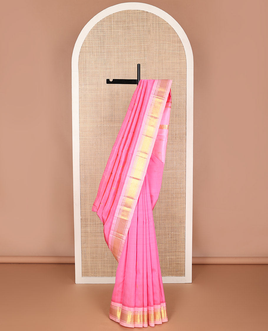 Baby pink buttas kancheepuram silk saree with contrast border of thilakam mokku, banras, checked design & zari design pallu