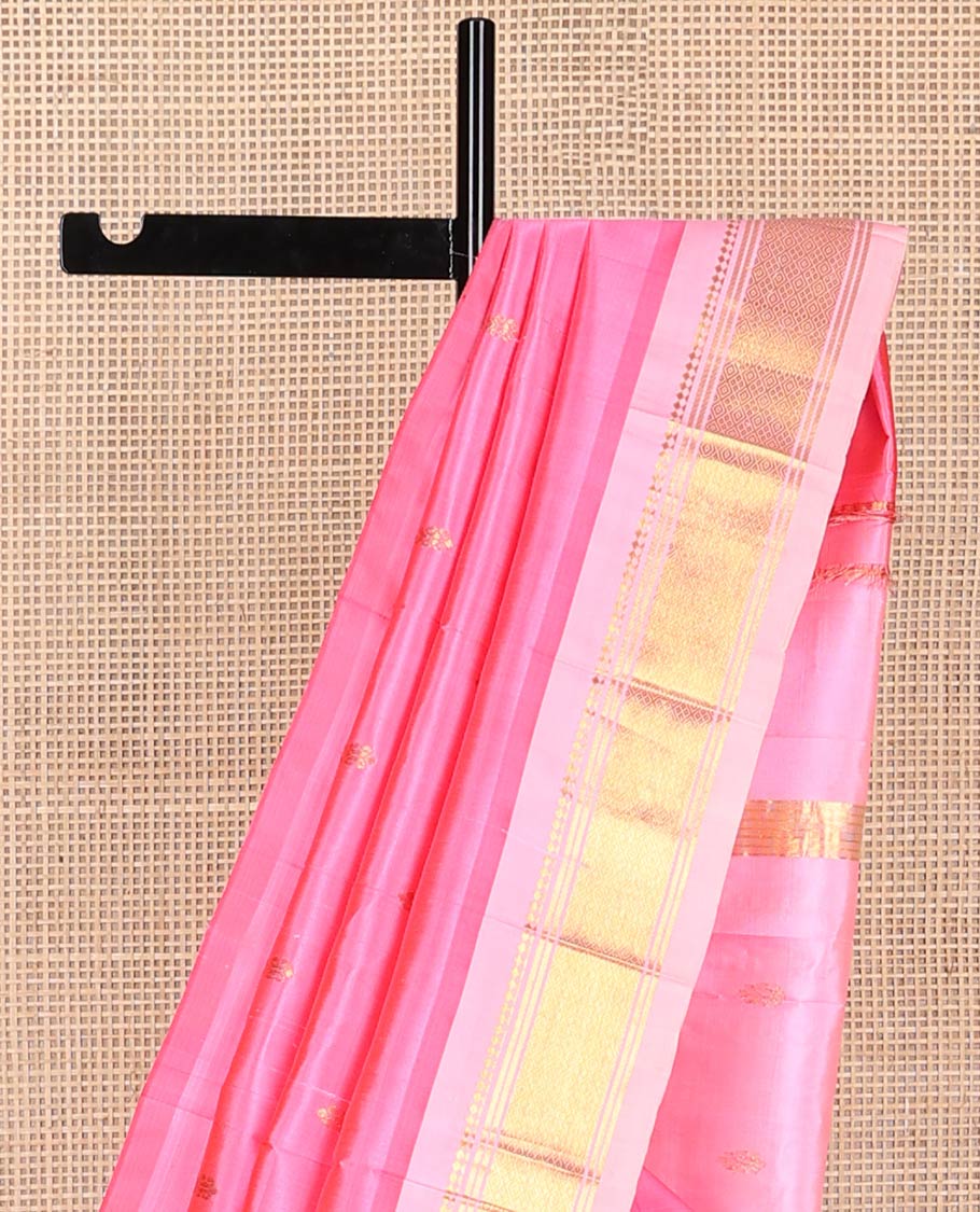 Baby pink buttas kancheepuram silk saree with contrast border of thilakam mokku, banras, checked design & zari design pallu