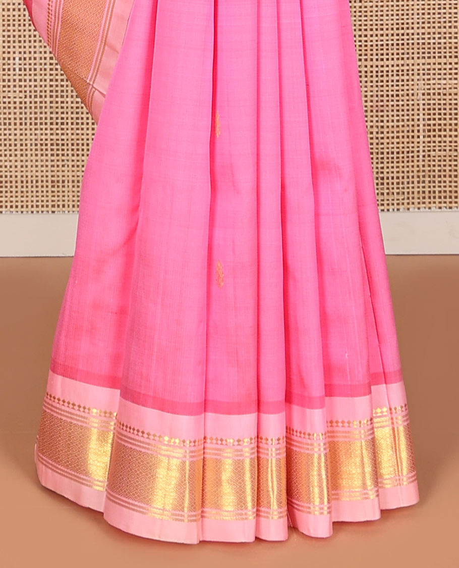 Baby pink buttas kancheepuram silk saree with contrast border of thilakam mokku, banras, checked design & zari design pallu
