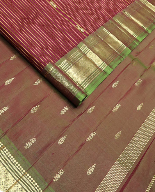 Maroon striped & zari buttas kanchipuram silk saree, contrast one-sided zari border of salngai,banaras,muthu & jaal & zari design pallu