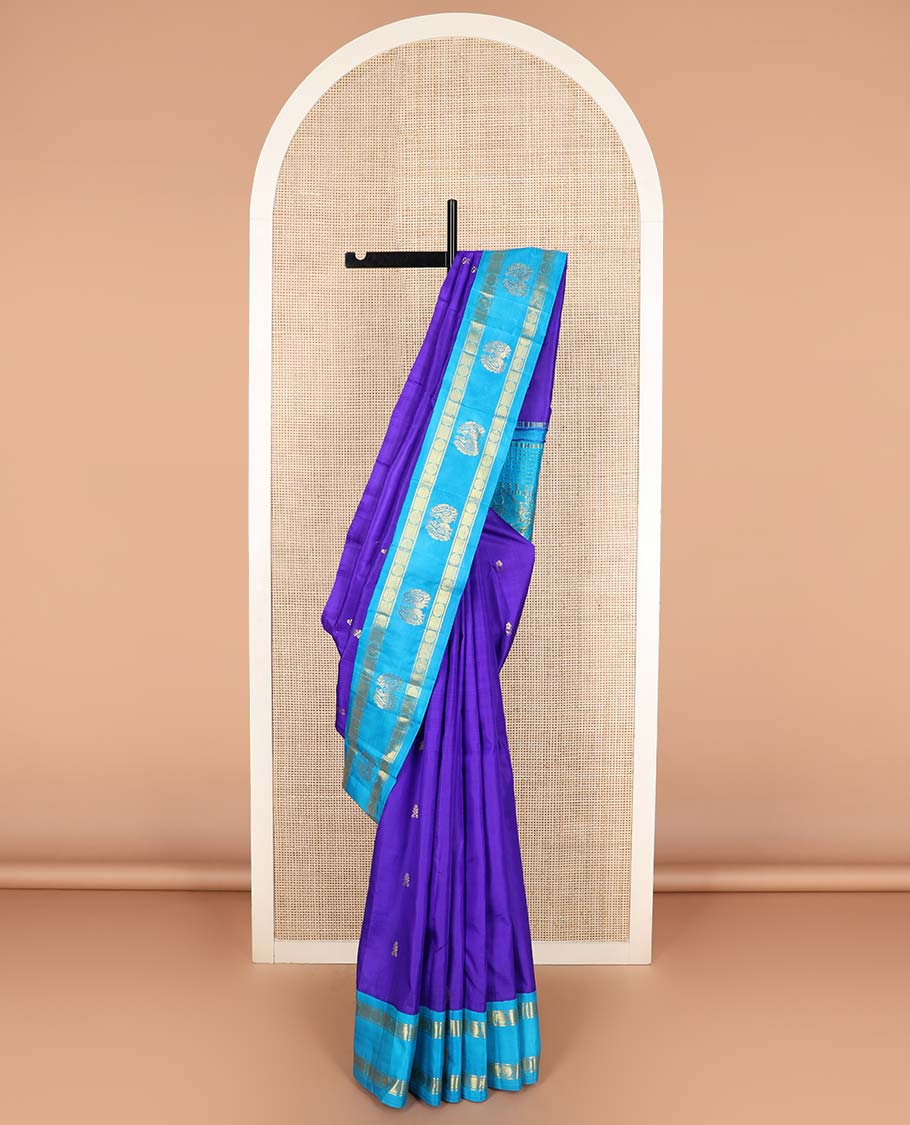 Blue zari buttas Kanchipuram silk saree, contrast one-sided korvai border of rudraksham and mayil designs, and floral design pallu