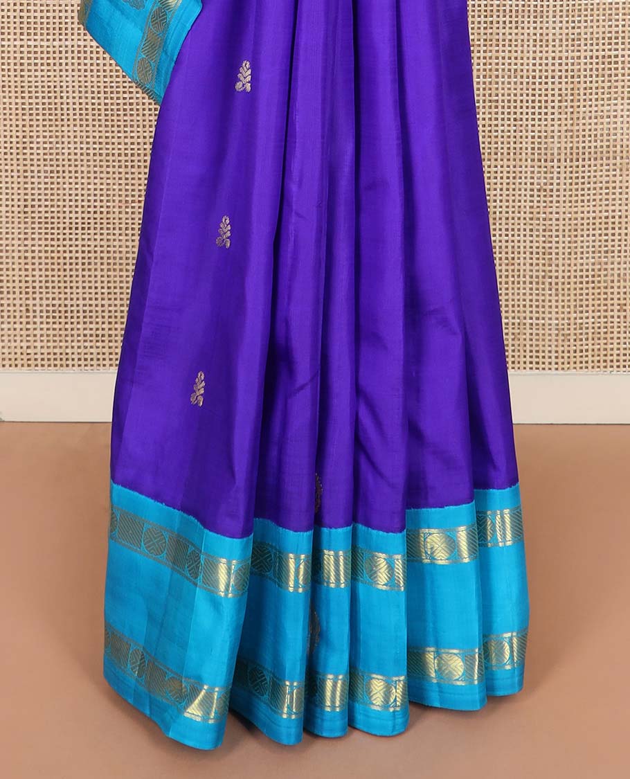 Blue zari buttas Kanchipuram silk saree, contrast one-sided korvai border of rudraksham and mayil designs, and floral design pallu