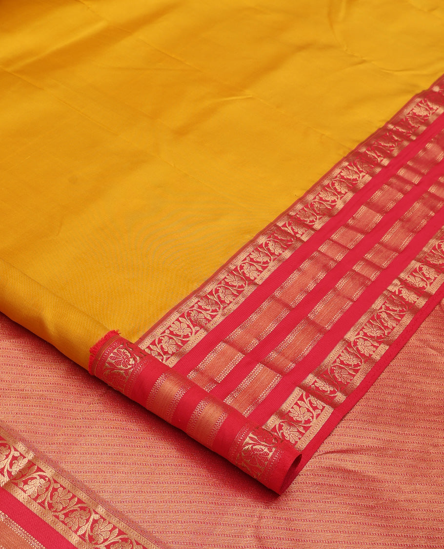 Yellow plain Kanchipuram silk saree, contrast border of muthu, neli, and kodi visiry designs, and diagonally woven pallu