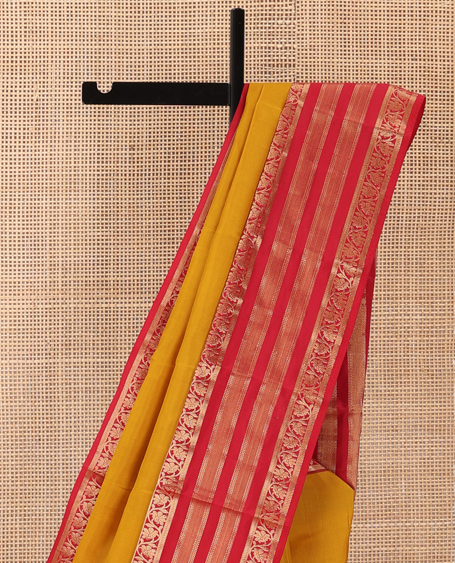Yellow plain Kanchipuram silk saree, contrast border of muthu, neli, and kodi visiry designs, and diagonally woven pallu