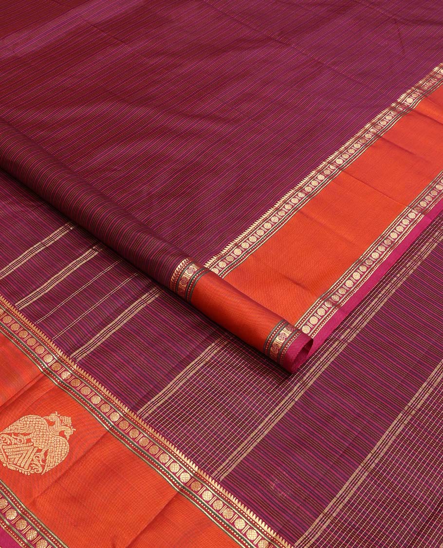 Purple striped Kanchipuram silk saree, contrast border of rekku, muthu, rudraksham and iruthalai pakshi motifs, and zari striped pallu