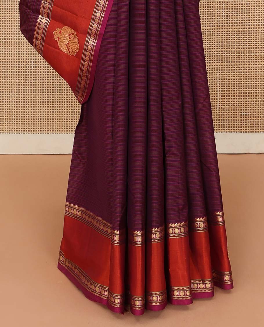 Purple striped Kanchipuram silk saree, contrast border of rekku, muthu, rudraksham and iruthalai pakshi motifs, and zari striped pallu