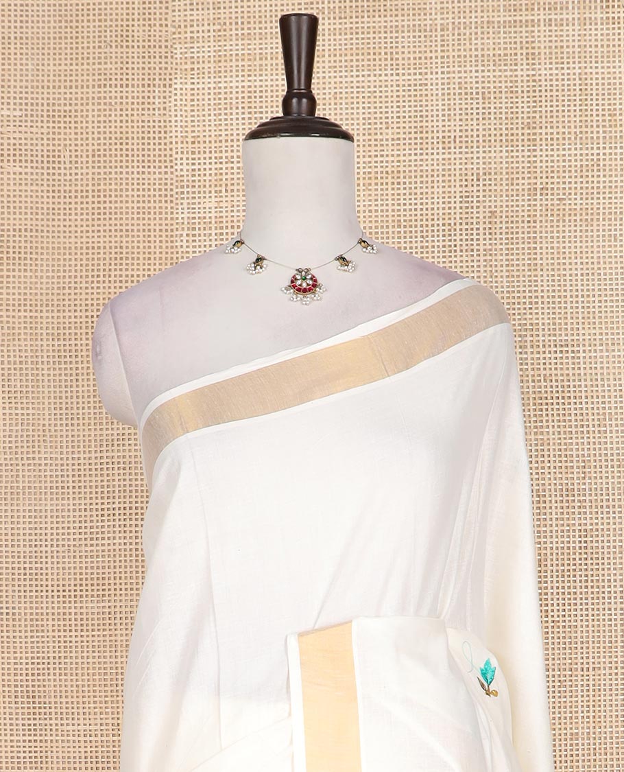 Cream floral motifs embroidered Kerala cotton saree, bavanji border, and peacock embroidered pallu