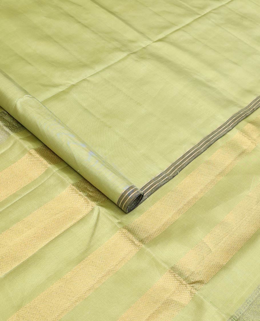 Green tree motifs zari woven soft silk saree, striped piping border, and pallu of zari designs