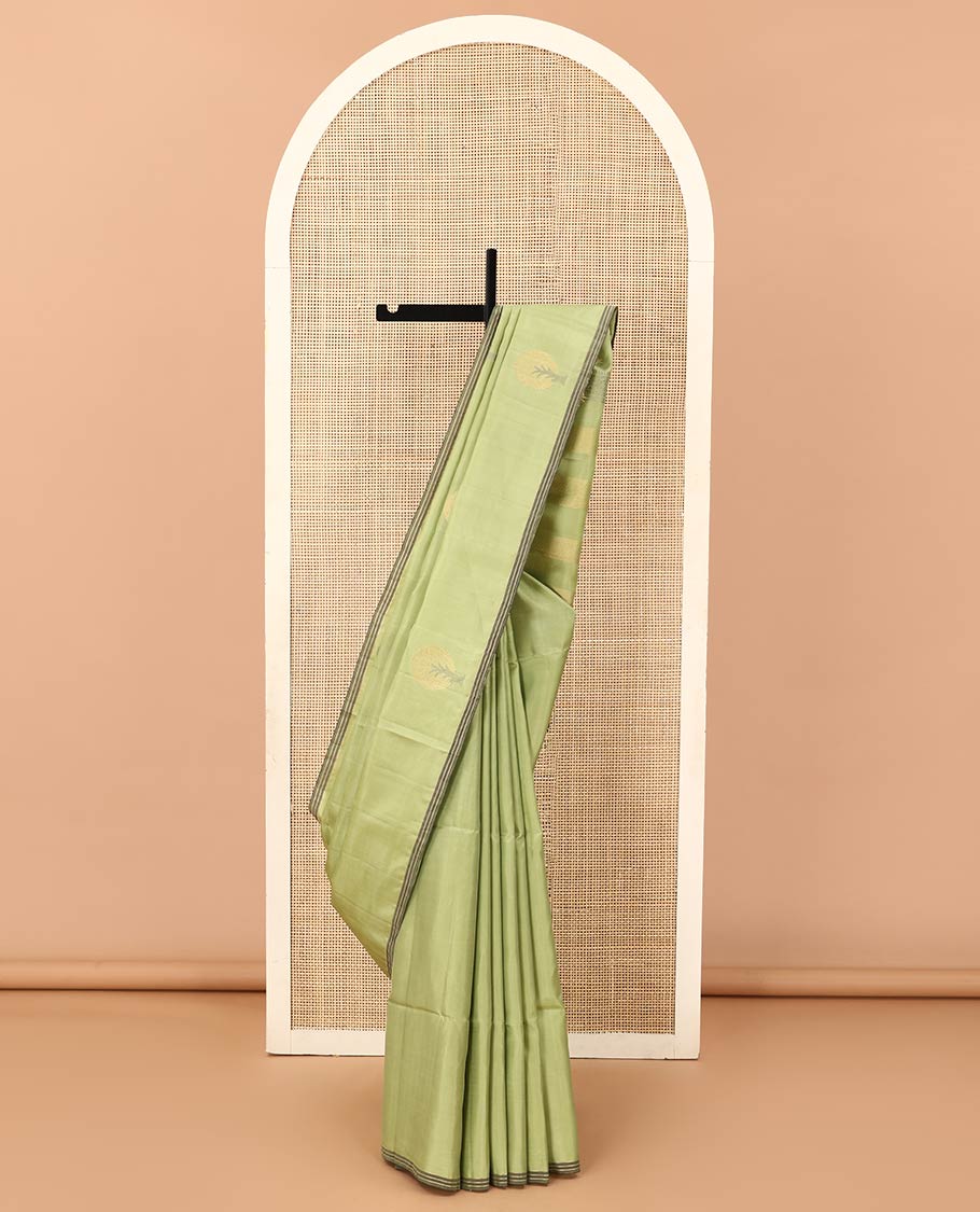 Green tree motifs zari woven soft silk saree, striped piping border, and pallu of zari designs