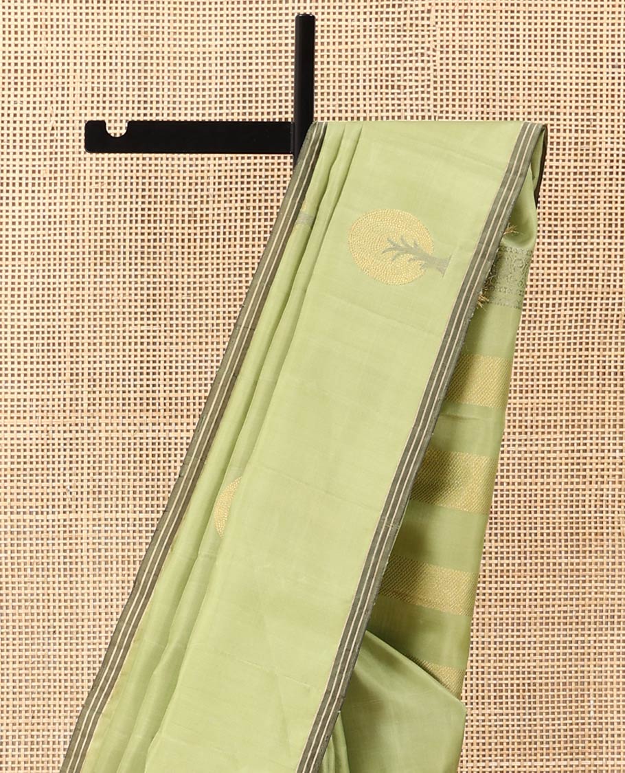 Green tree motifs zari woven soft silk saree, striped piping border, and pallu of zari designs