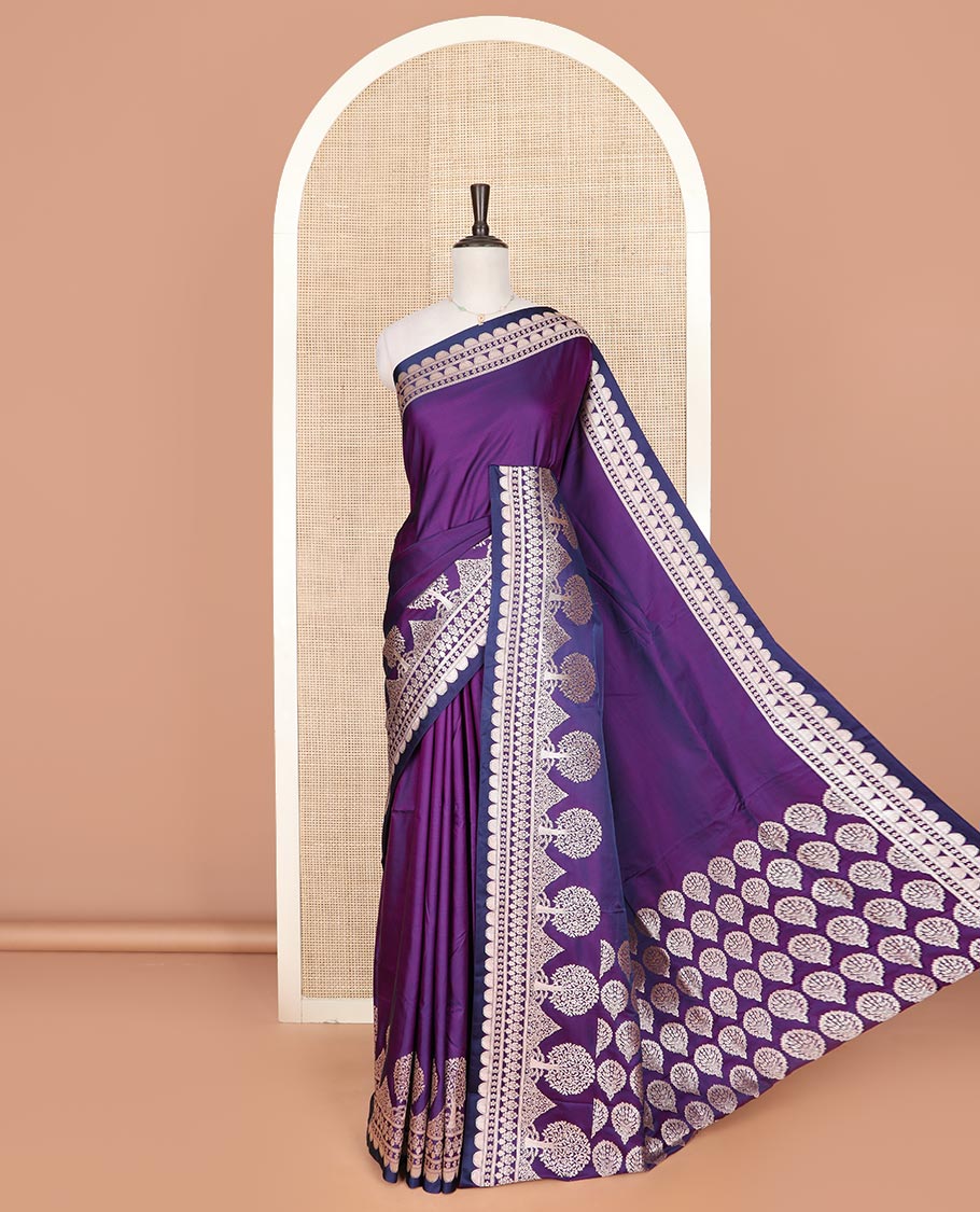 Purple plain mushru silk saree, self-border of scallop design, floral, and tree motifs, and intricately designed pallu