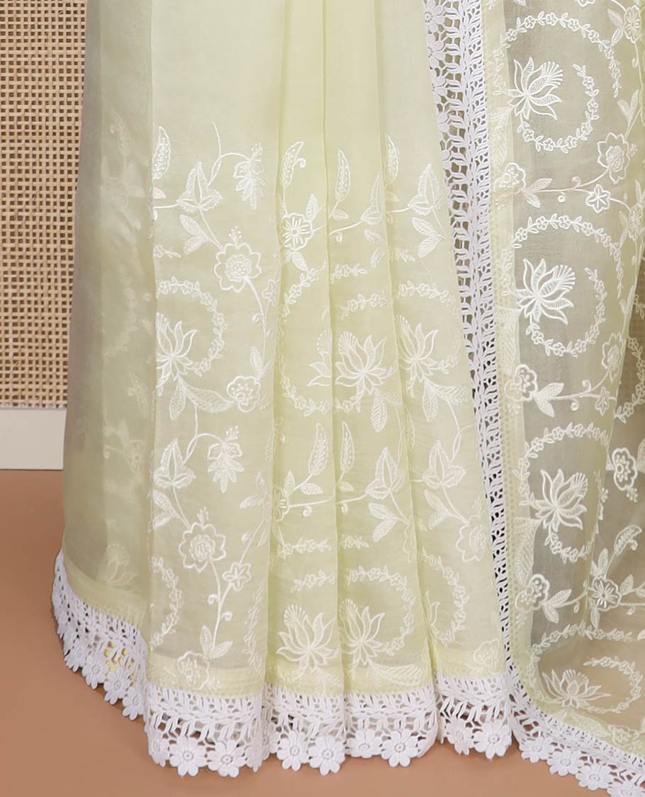 Lemon yellow floral design organza saree with lace border