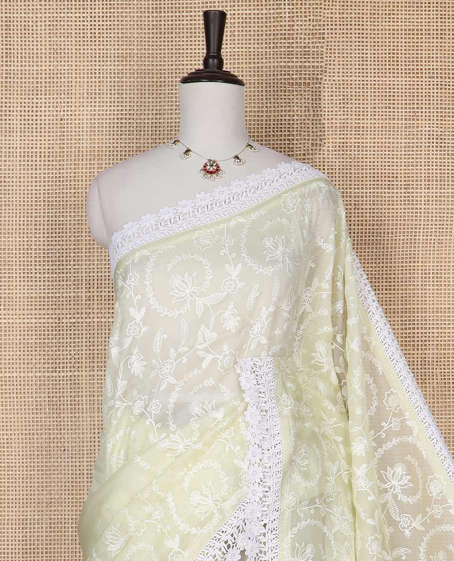 Lemon yellow floral design organza saree with lace border