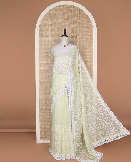 Lemon yellow floral design organza saree with lace border
