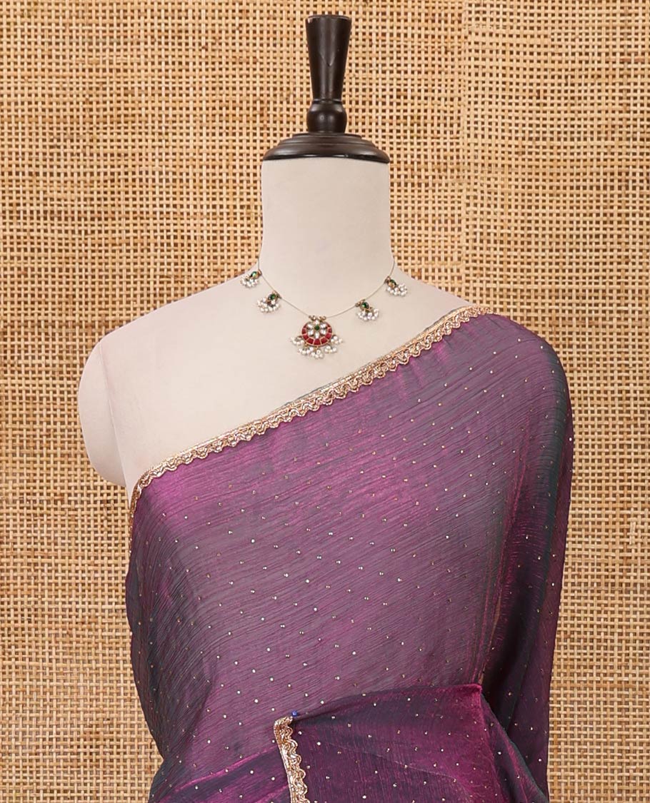 Dark violet Swarovski stone work embedded fendy-chiffon saree, scallop lace border & floral mixed embroidered blouse