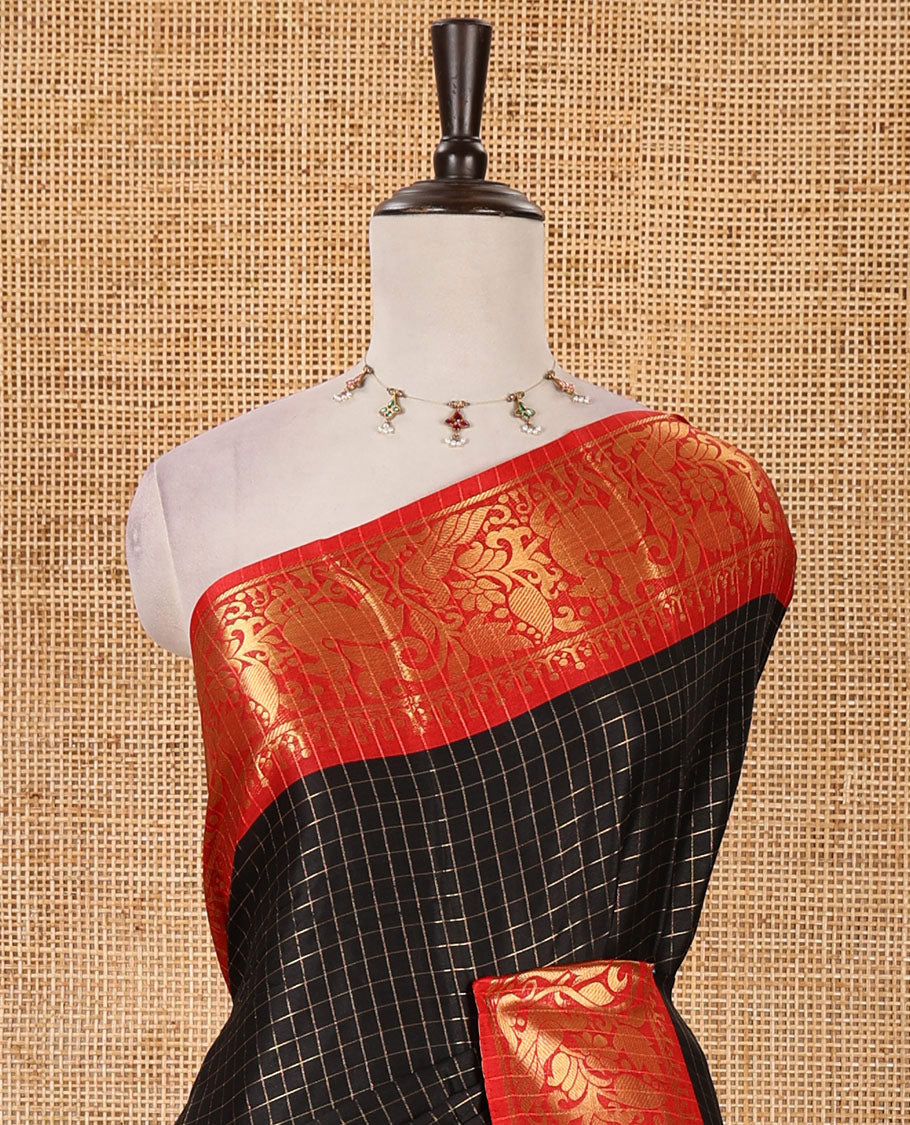 Navy blue zari checked semi-taffeta silk saree, contrast deer motifs zari woven temple border, striped pallu & contrast striped zari border blouse