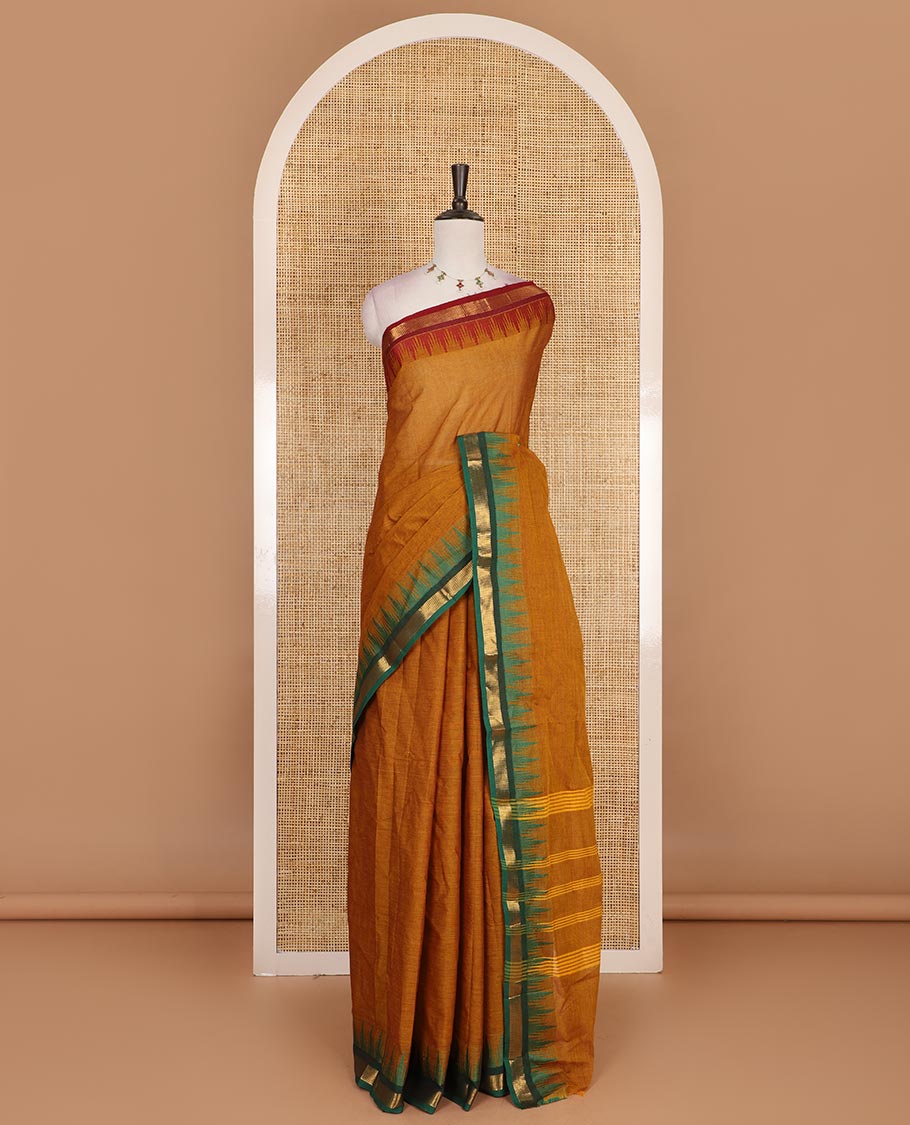 Mustard plain Chettinad cotton saree, contrast ganga jamuna temple zari border, striped pallu, and plain blouse