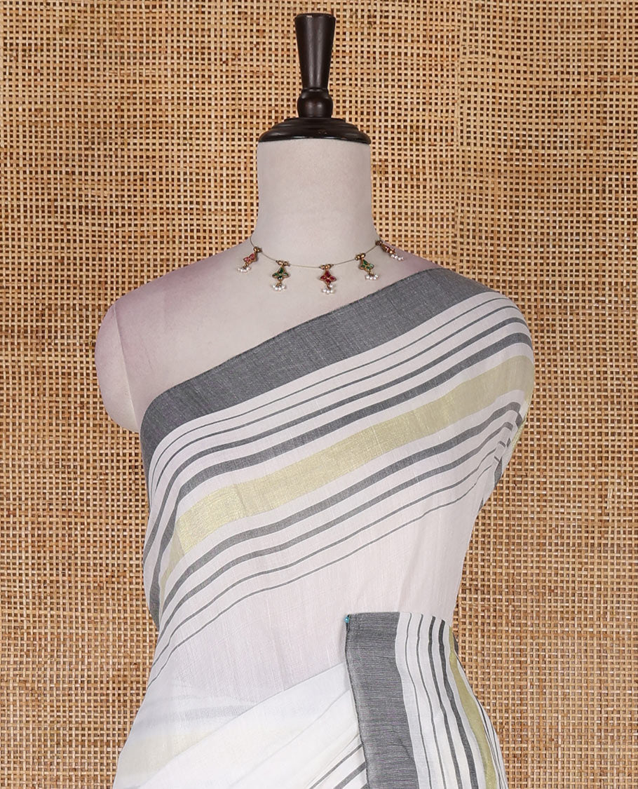 Cream-grey plain design mul mul cotton saree, contrast gold zari horizontally striped border, plain pallu, and plain blouse