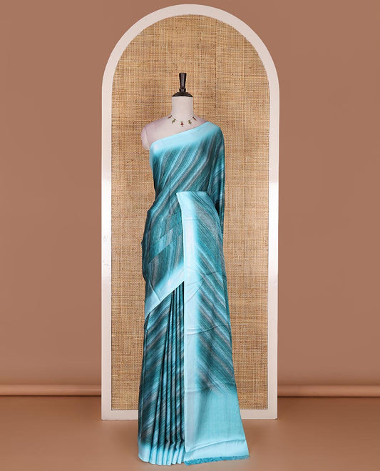 Blue leheriya style hand brush printed satin crepe saree, contrast border, plain pallu, and floral vine printed blouse