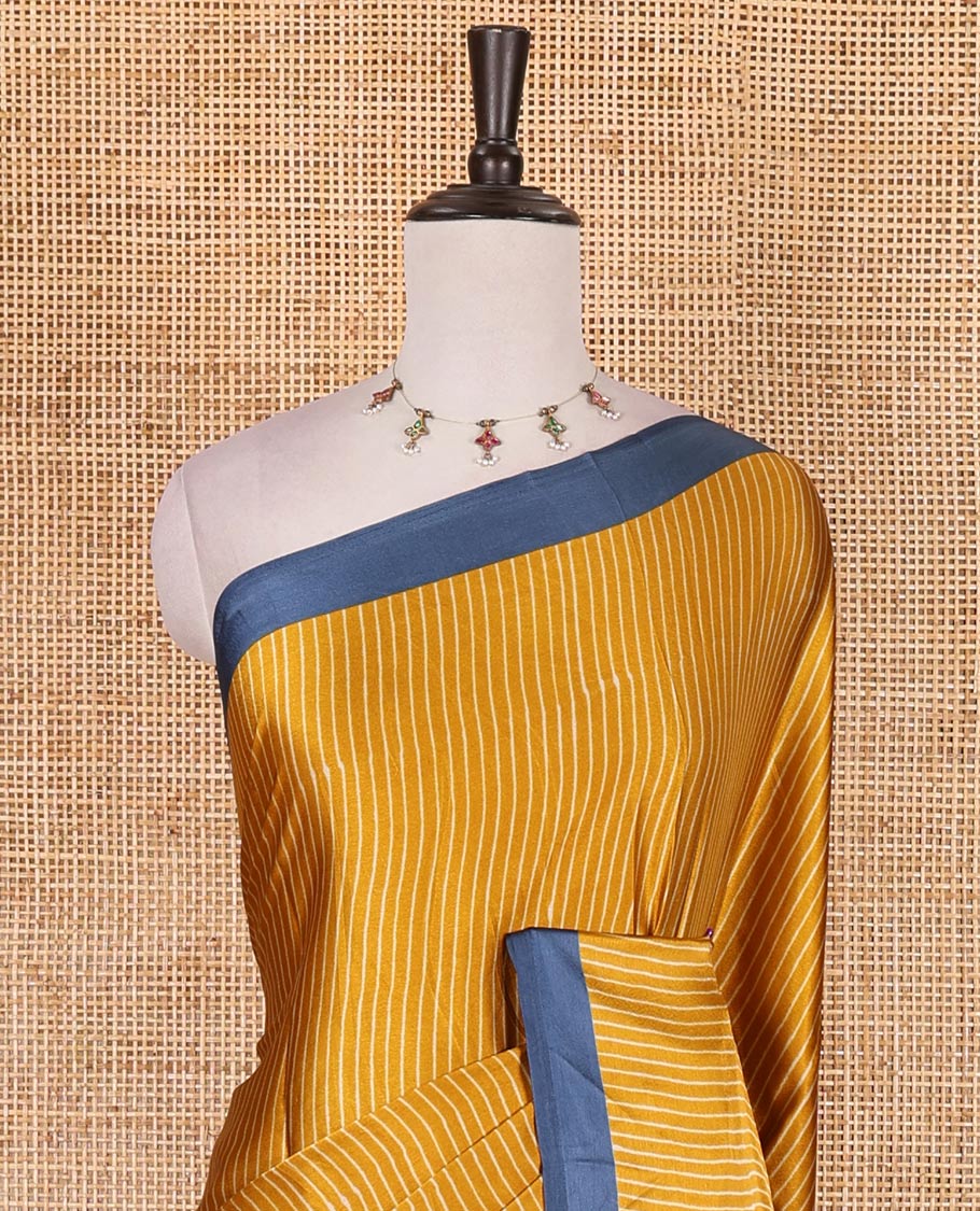 Mustard vertical striped gaji silk saree, contrast plain border, ajrakh printed pallu and contrast plain blouse