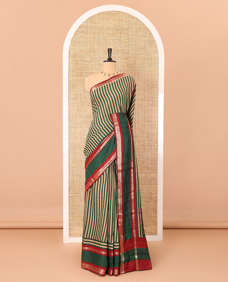 Green vertically striped muslin silk saree, contrast zari rettai pettu border, kalamkari floral vine printed pallu, and a contrast plain blouse