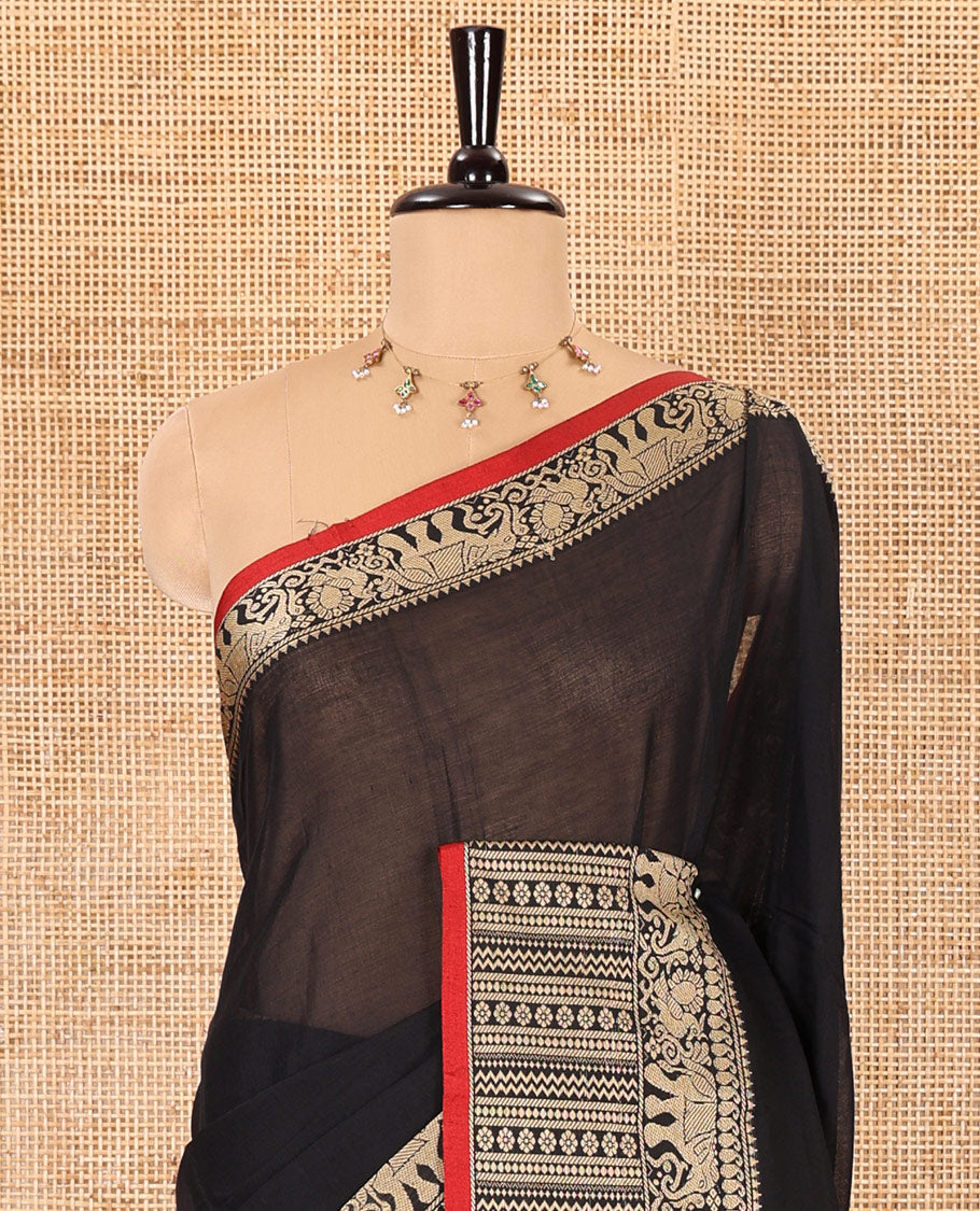 Black plain mercerised cotton saree, contrast traditional motifs thread woven border, striped pallu, and a matching blouse