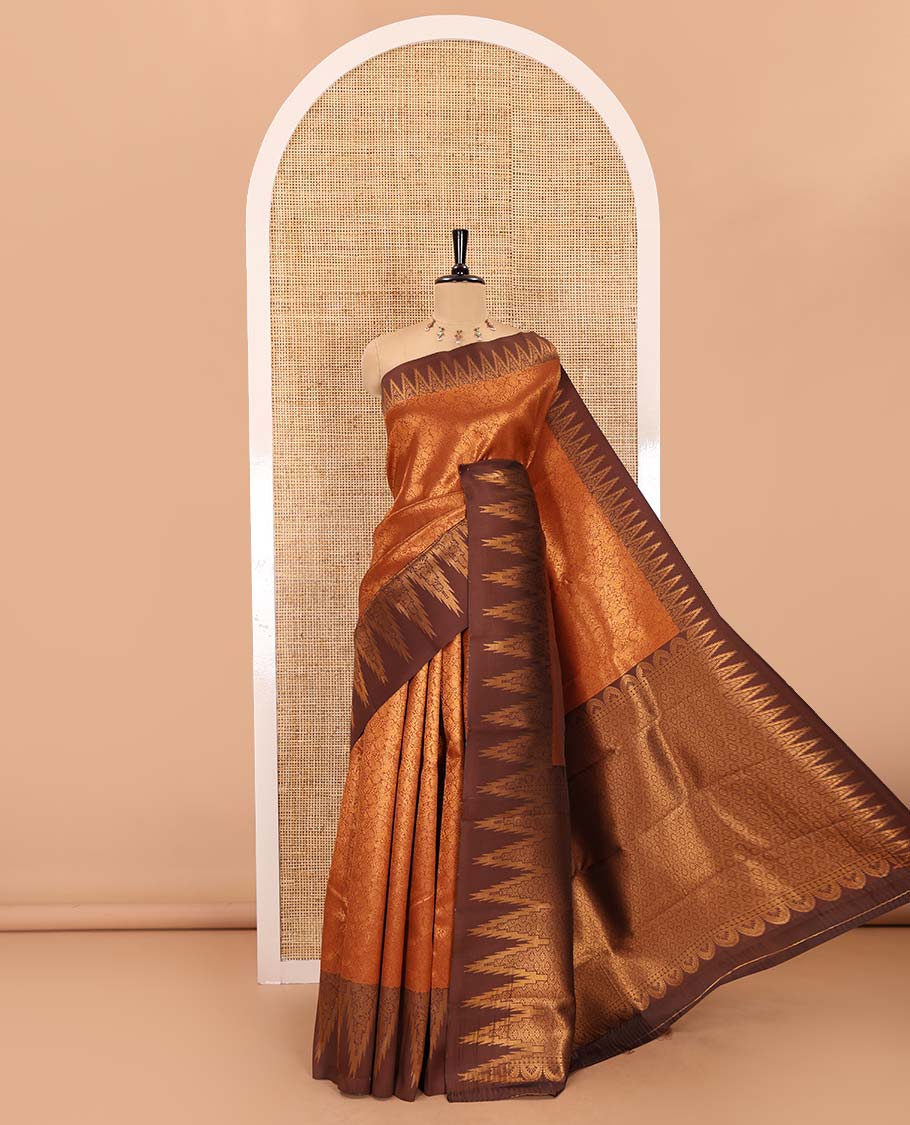 Rust orange-brown floral and bird jacquard kanchi silk saree, contrast temple border, zari-rich jaal pallu, and a jacquard blouse