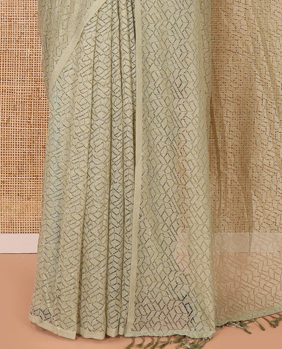 Borderless pista green sparkling glittered russel net saree, self-pallu and a floral print with zig-zag embroidered blouse