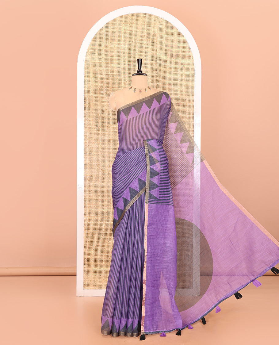 Lavender vertical stripes printed linen cotton saree, a temple-printed border, big polka dot printed pallu, and a printed blouse