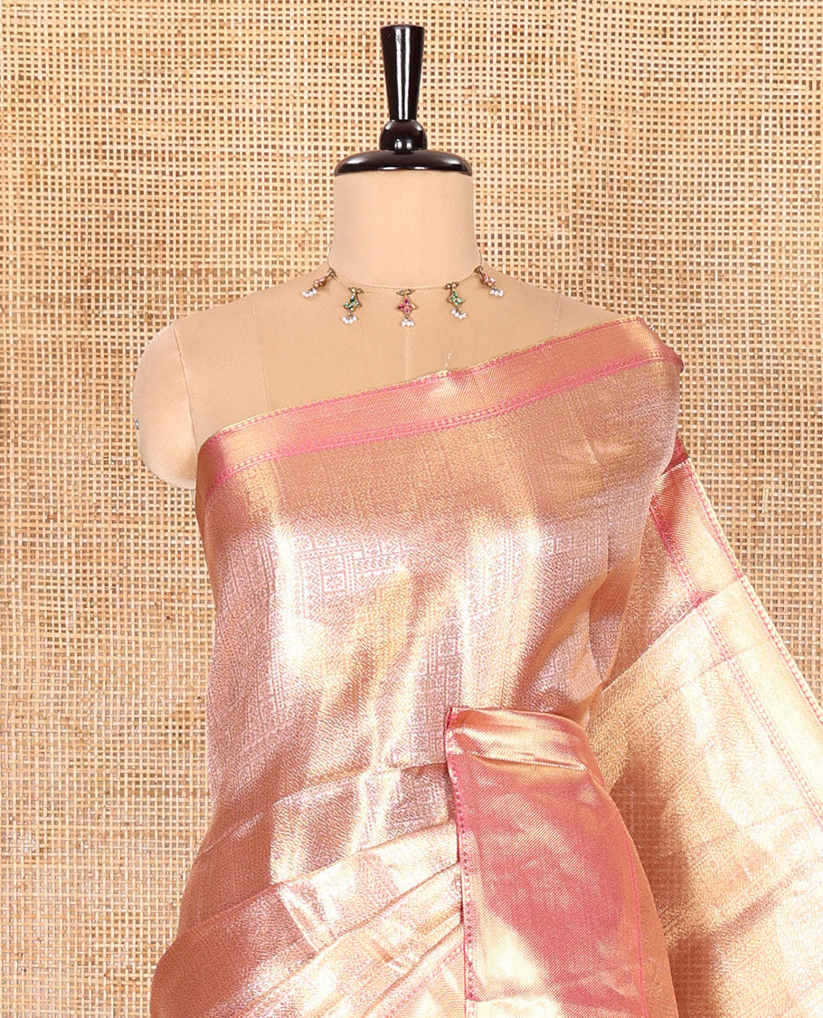 Pastel Pink Tissue Saree Features Floral Jacquard Design Woven All Over Its Body, Features a Contrast Gleaming Zari Traditional Design Border, Zari-Enriched Pallu, and a Matching Blouse