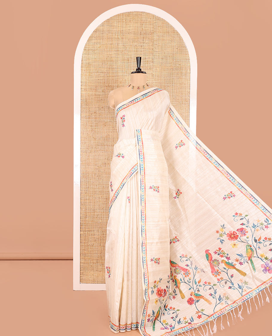 Chikku Semi-Tussar Silk Saree, Embellished with Floral Motifs Printed on Its Body, a Subtle Chevron Striped Border, Pallu Accentuated by Colorful Floral Vine and Bird Print, and Paired with a Matching Printed Blouse