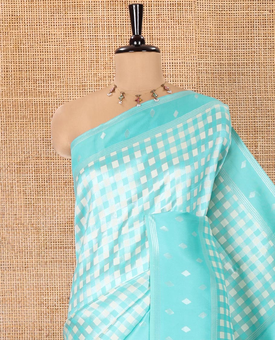 Blue Kanchi Silk Saree, Decked Up with Checked Design on Its Body, Highlighted by a Self-Border of Diamond Patterns, Pallu Steeped with Buttas, and Paired with a Matching Blouse