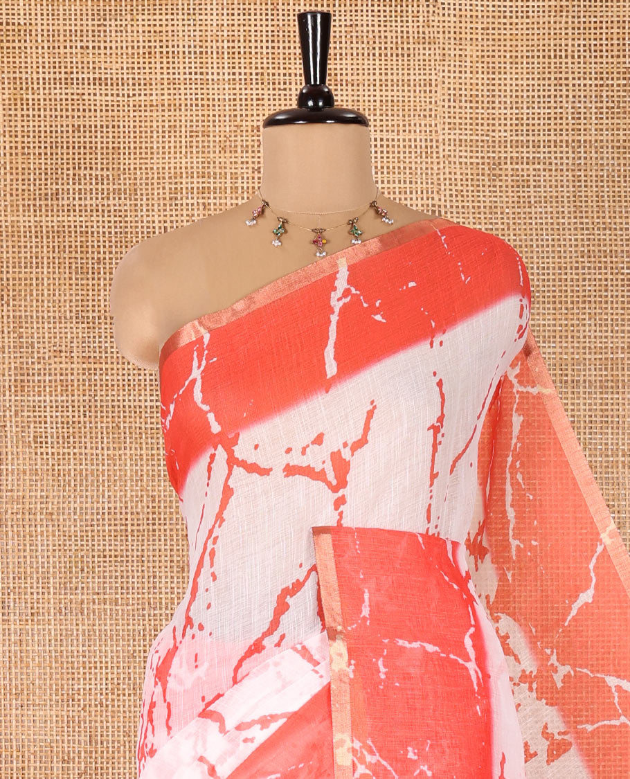 Cream and Red Linen Cotton Saree, Elevated with Batik Print on Its Body, Complemented by Contrast Batik Printed Border, Pallu of Floral Print, and Paired with a Contrast Blouse