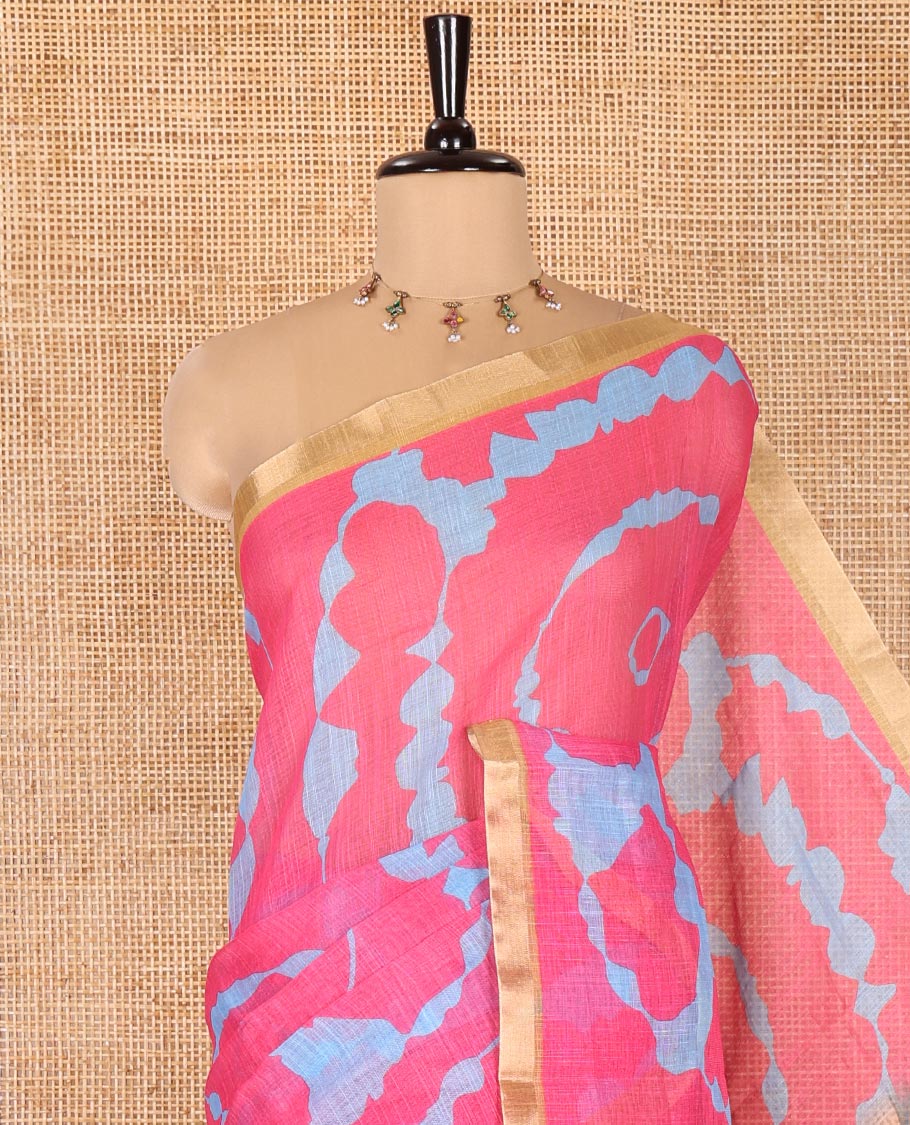 Pink Linen Cotton Saree, Adorned with Shibori Print On Its Body, Subtle Piping Border, Pallu Steeped with Floral Vine Print, and Paired with a Printed Blouse