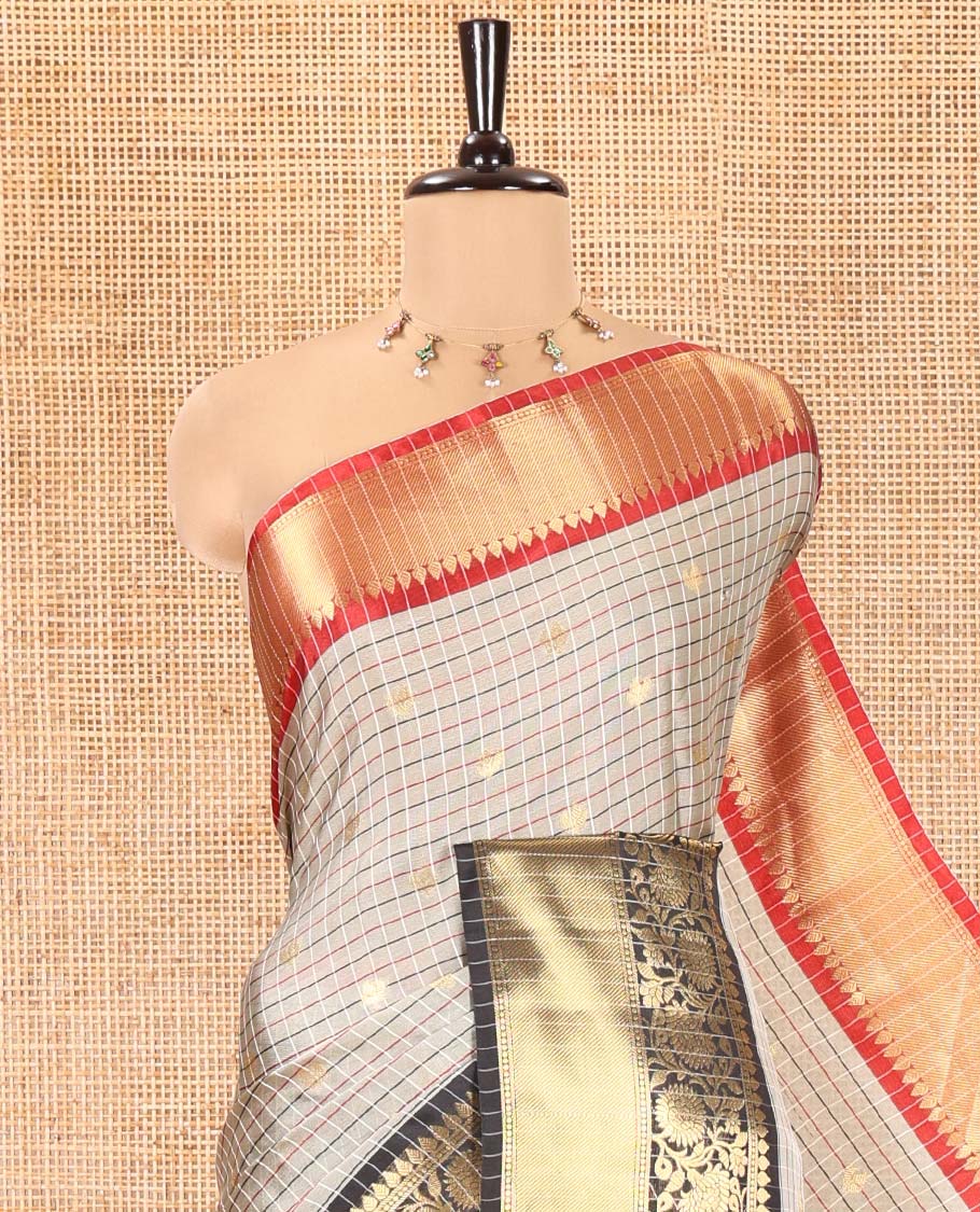 Grey Semi-Soft Silk Saree, Accentuated with Buttas and Checks On Its Body, Complemented by Contrast Traditional Zari Designs Woven Ganga-Jamuna Border, Pallu Steeped with Buttas, and Paired with a Matching Blouse