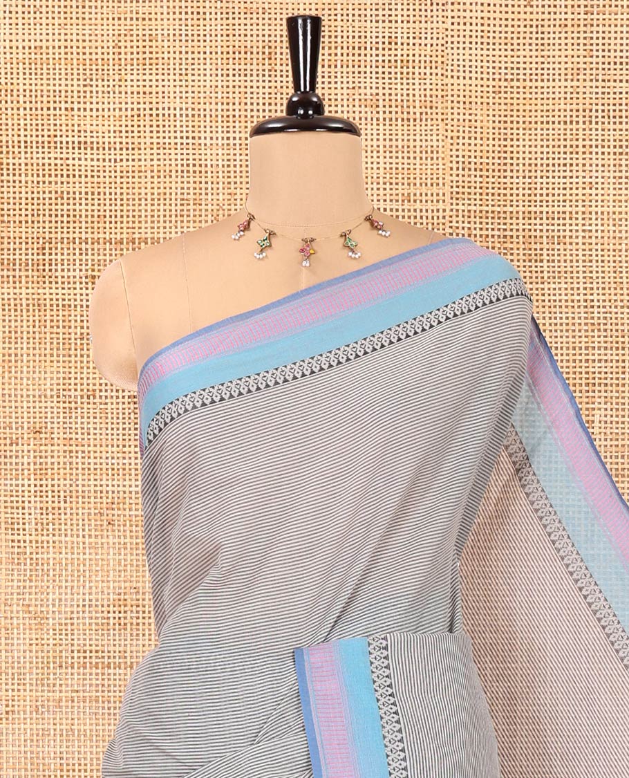Grey Chettinad Cotton Saree, Sparsely Designed with Stripes on Its Body, Complemented by Contrast Traditional Design Border, Striped Pallu, and Paired with a Matching Blouse