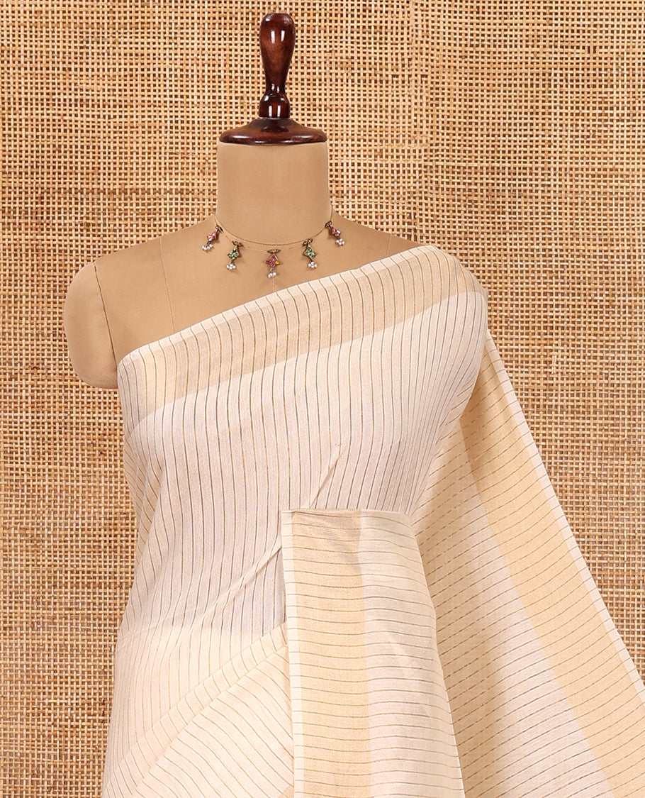 Cream Bhagalpuri Cotton Saree Features Vertical Stripes, a Zari Border, and a Matching Blouse