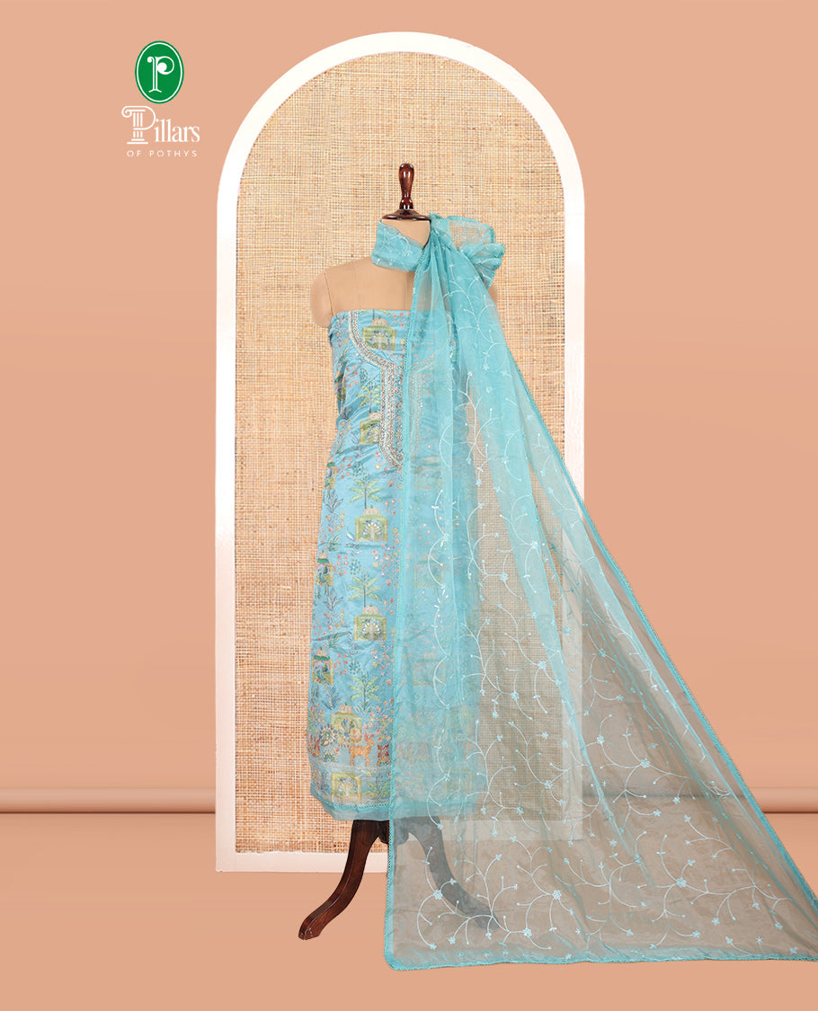 Sea Blue Organza Material Churidar, Intricately Printed Outlined Embroidery Top, a Matching Bottom, and a Floral Embroidered Dupatta