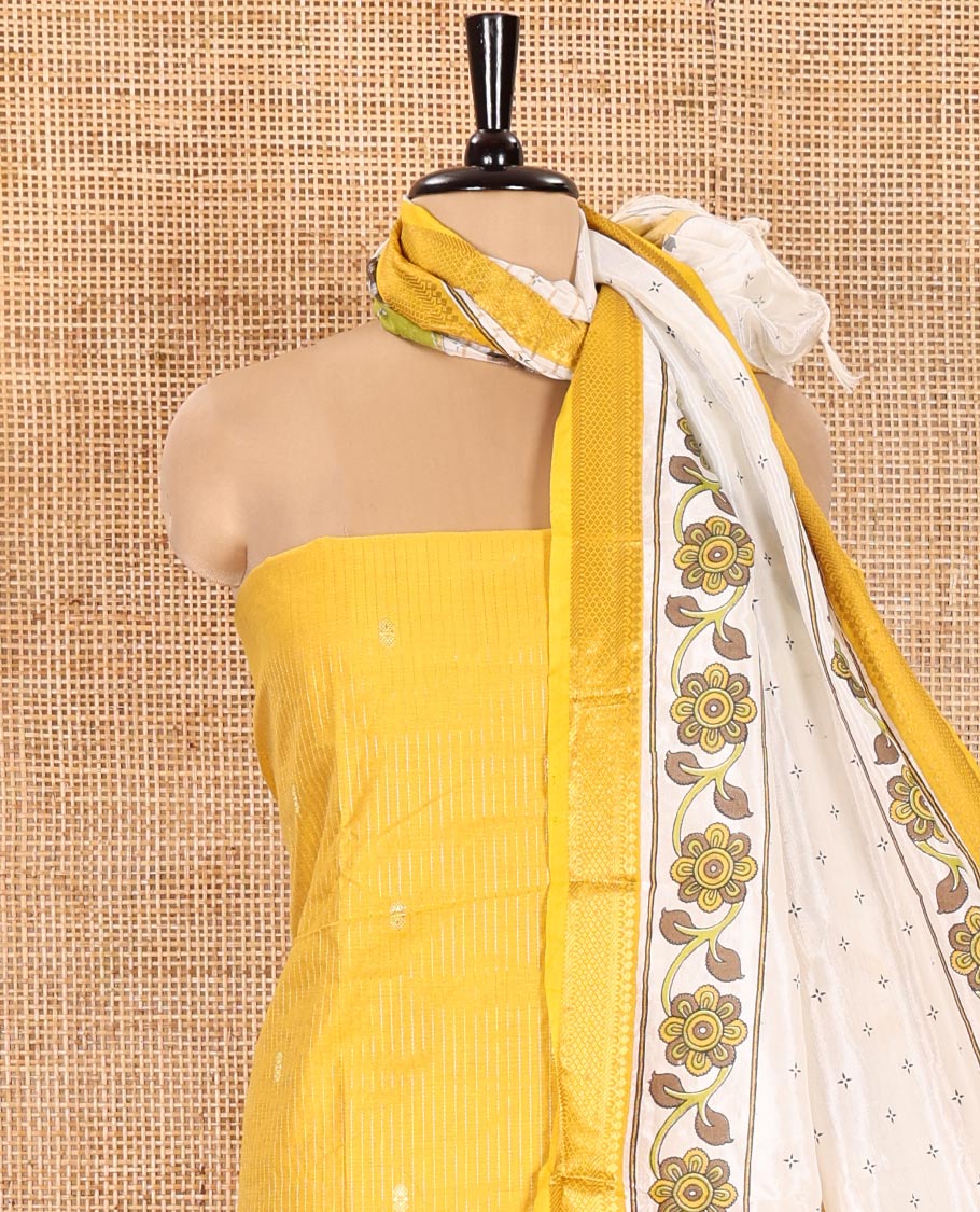 Yellow Material Chudidhar Set, Delicately Woven with Dotted Stripes and Buttas on Its Semi-Silk Top, Plain Cotton Bottom, and Semi-Silk Dupatta Illustrating Pichwai Cow and Floral Print