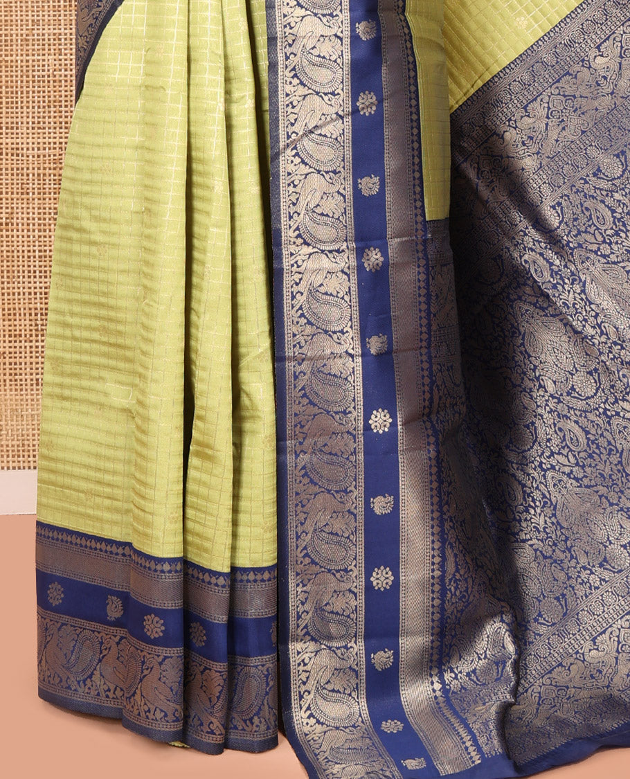 Pista Green Litchi Saree Features Buttas and Checks, Contrast Traditional Peacock Border, Intricate Pallu, and a Contrast Blouse