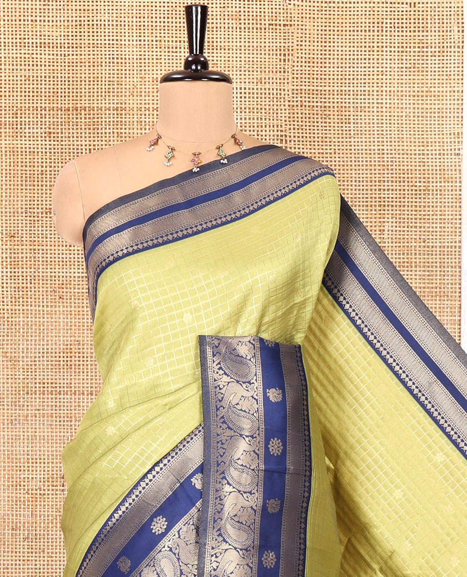 Pista Green Litchi Saree Features Buttas and Checks, Contrast Traditional Peacock Border, Intricate Pallu, and a Contrast Blouse