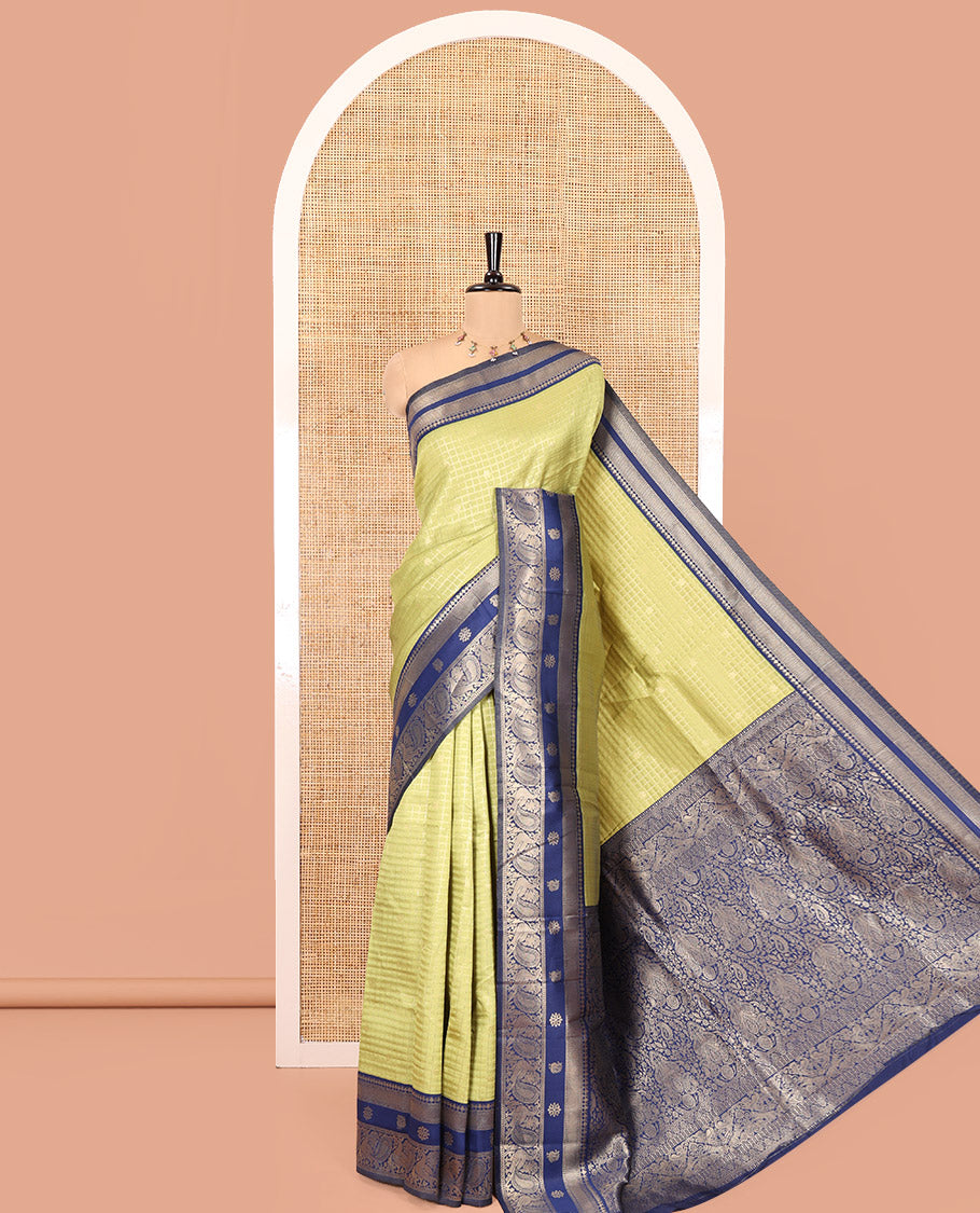 Pista Green Litchi Saree Features Buttas and Checks, Contrast Traditional Peacock Border, Intricate Pallu, and a Contrast Blouse